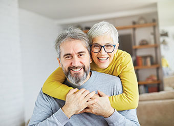 Couple smiling. Link to Life Stage Gift Planner Ages 45-65 Situations.